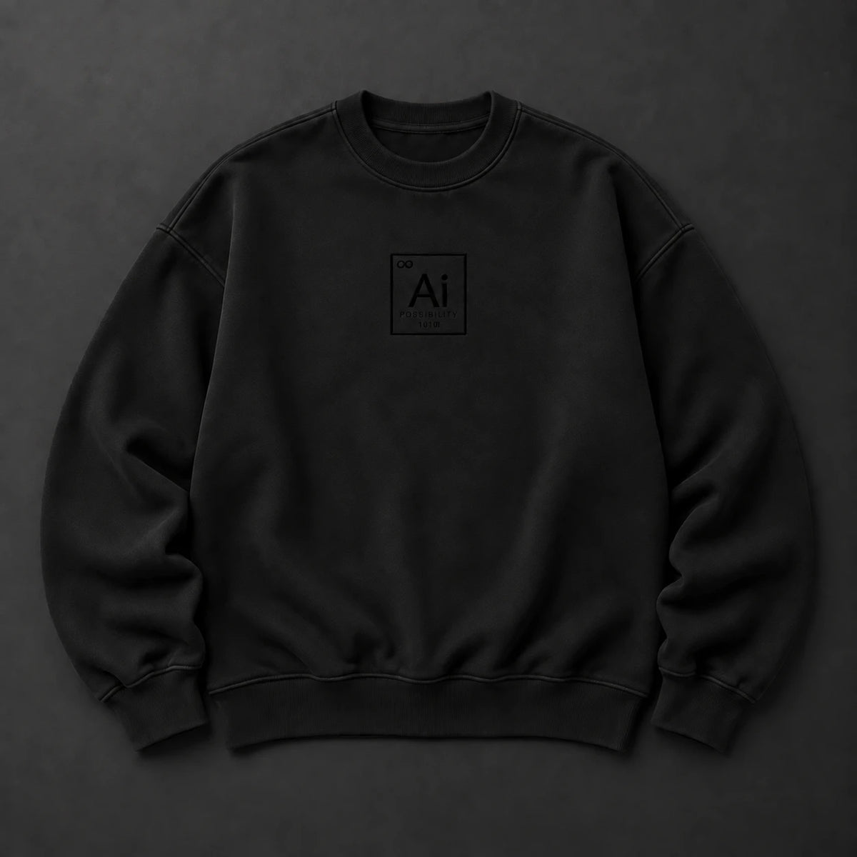 The Possibility Crewneck in washed black laid flat on a charcoal surface