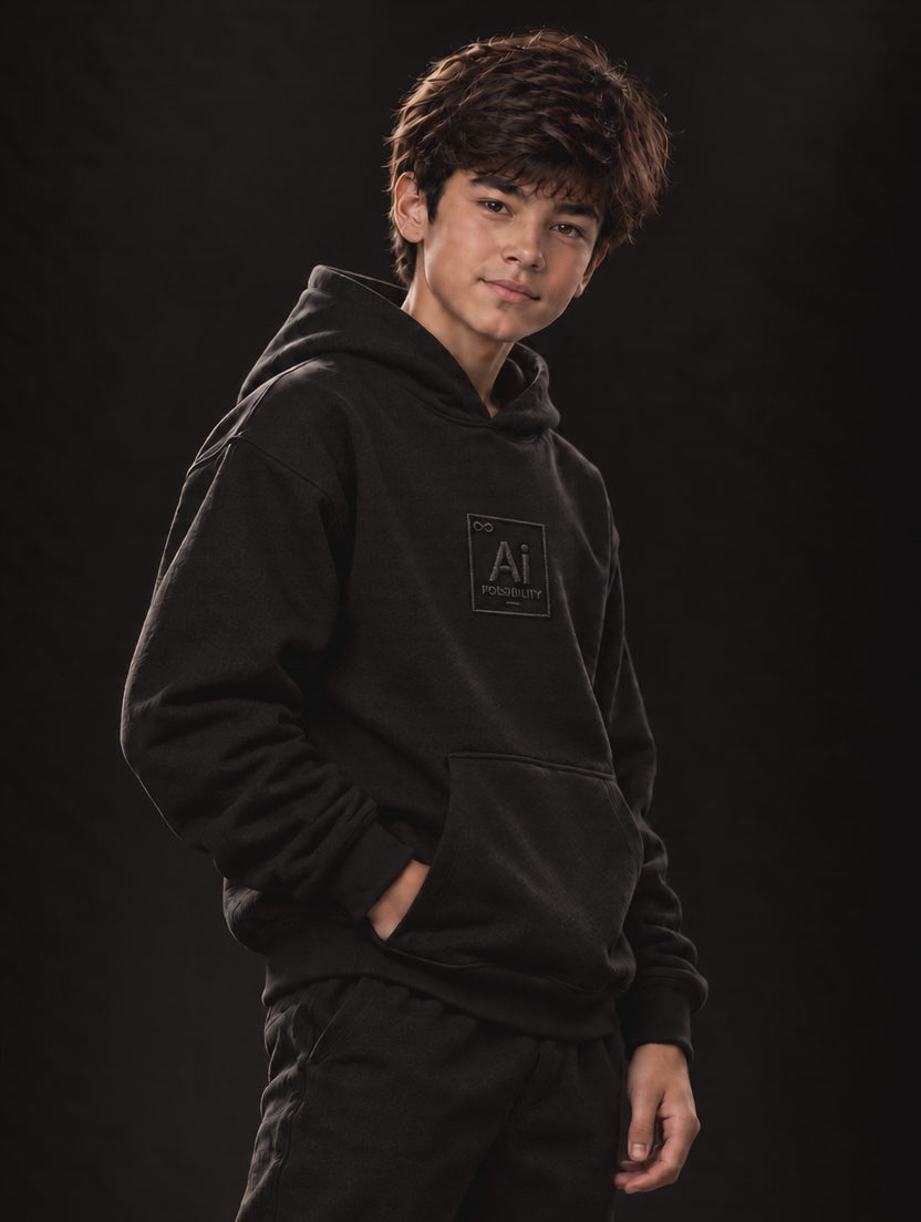 Young model wearing the Possibility Youth Hoodie in black, short video